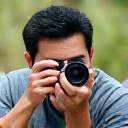 Portrait of David Lee, Wildlife Photographer, with camera in hand, outdoors.